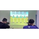 game with laser guns that interact with the projected elements